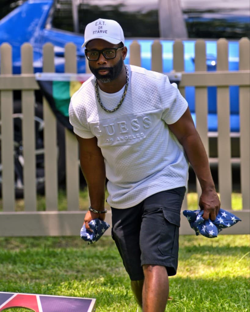 Alonzo Waheed outdoors during community recovery work
